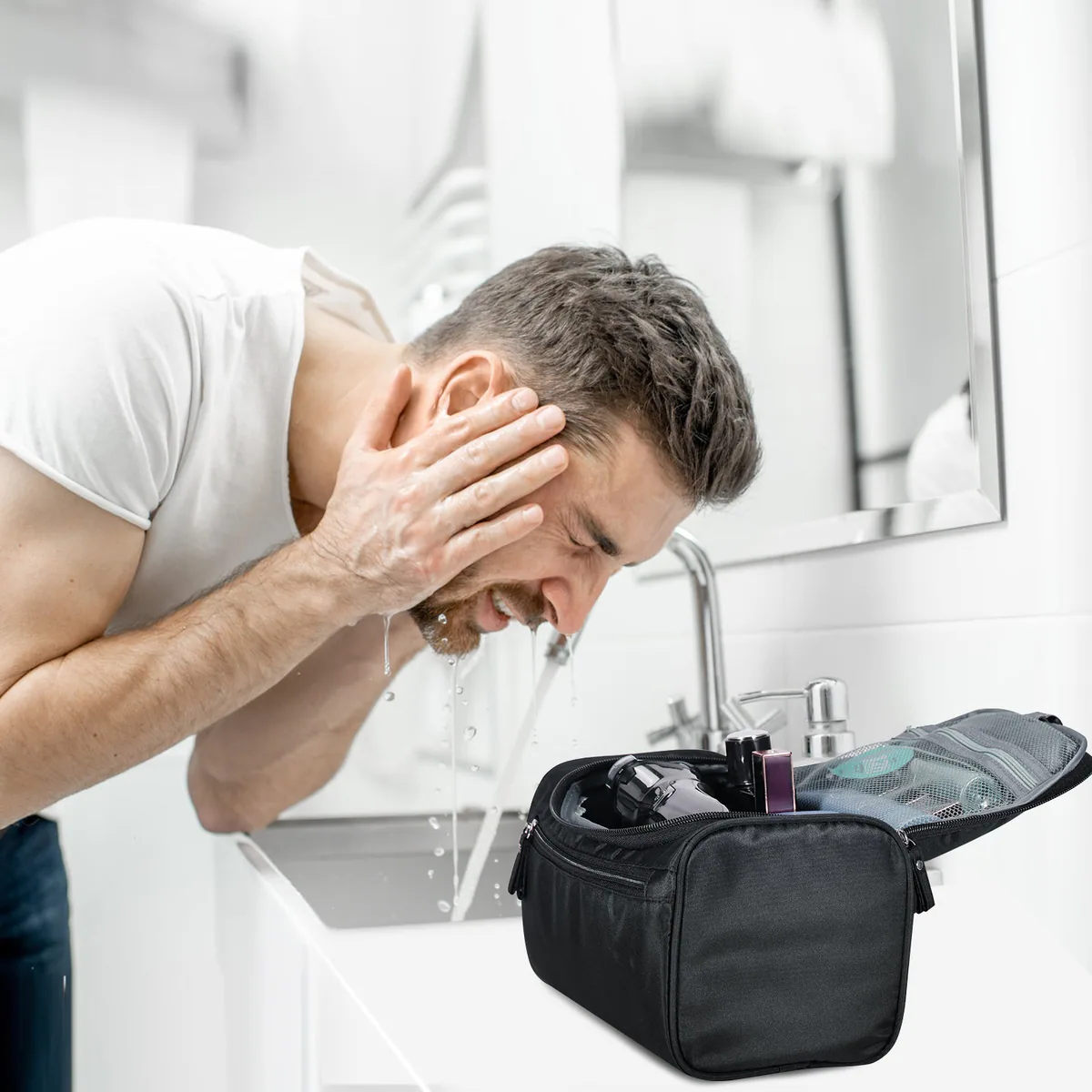 PNEUICALLY hanging toiletry bag open beside a bathroom sink